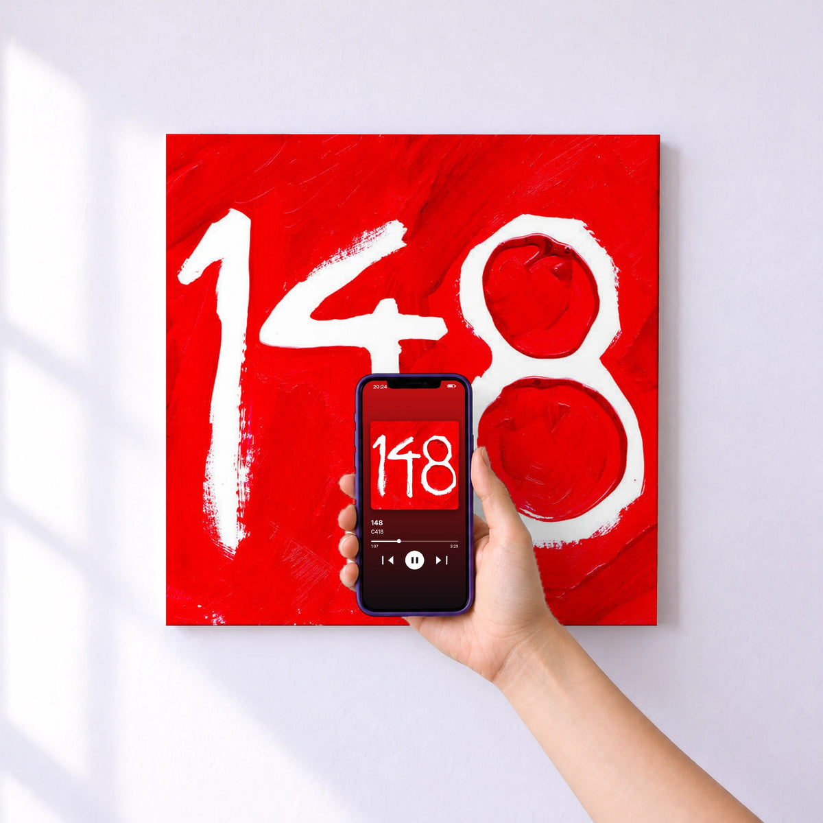 Affiche connectée 148 de C418 au mur : l'album se lance en approchant le téléphone