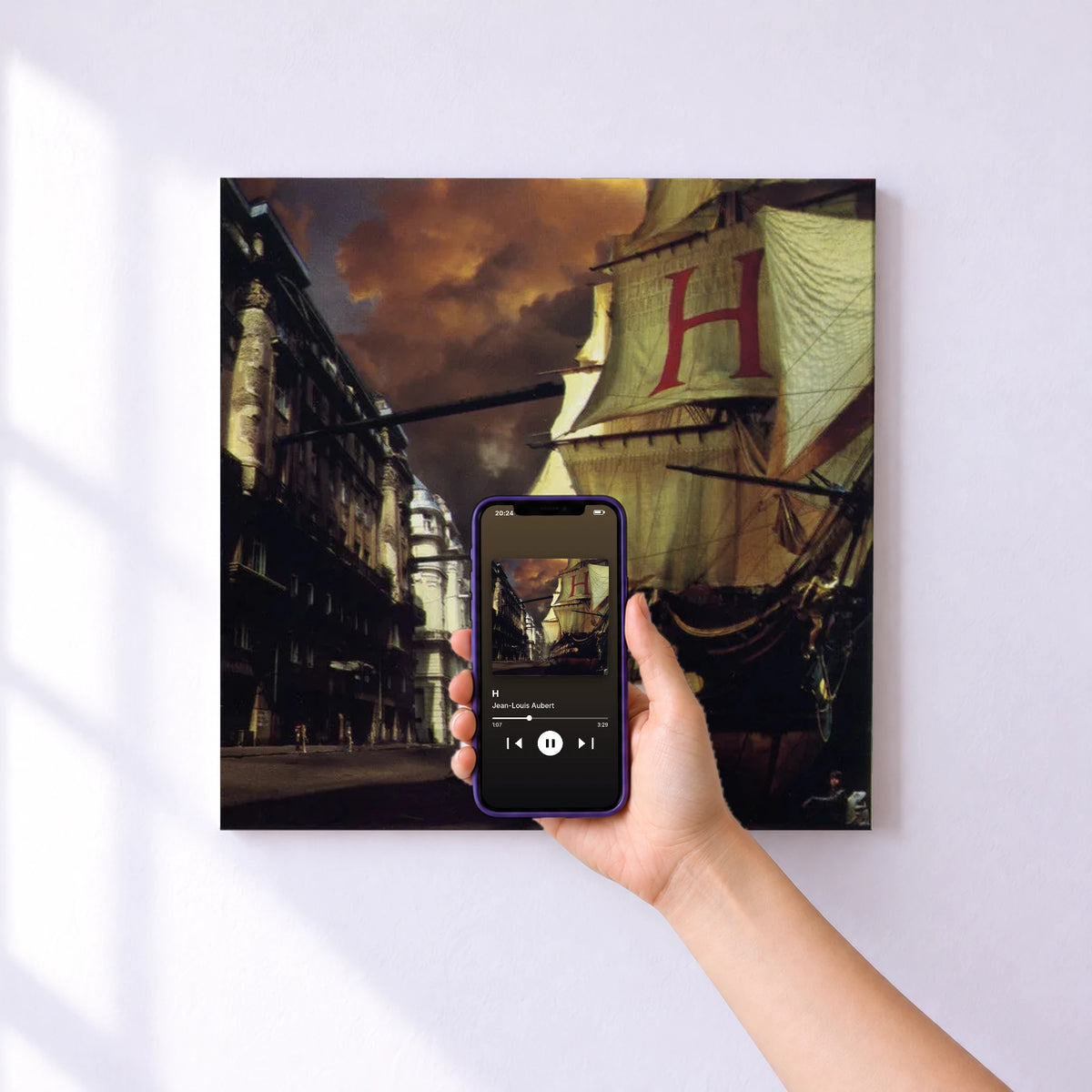 Affiche connectée H de Jean-Louis Aubert au mur : l'album se lance en approchant le téléphone