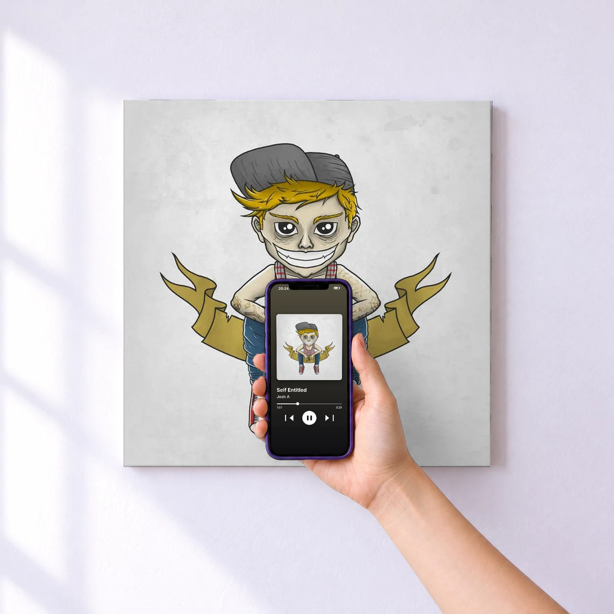 Affiche connectée Self Entitled de Josh A au mur : l'album se lance en approchant le téléphone
