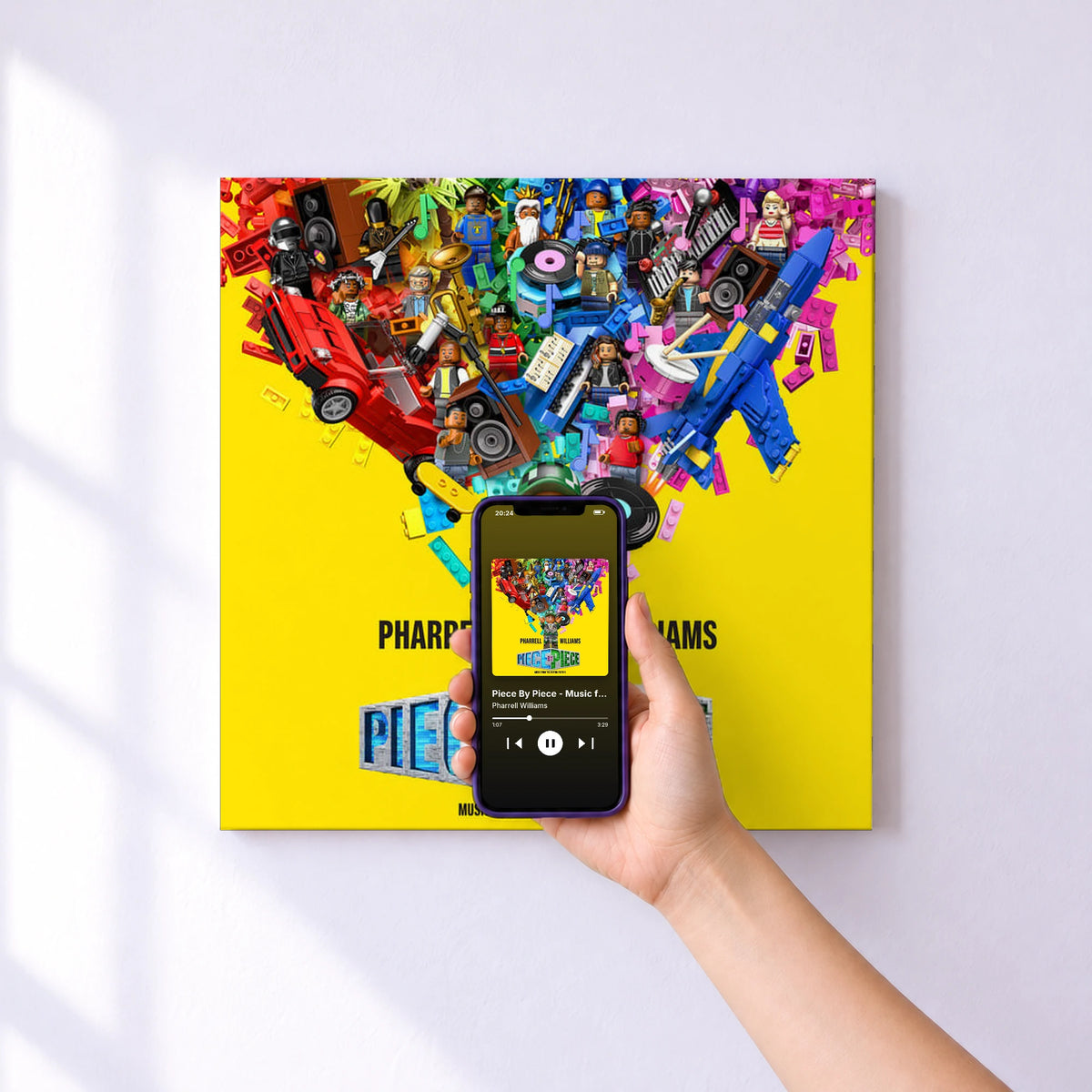 Affiche connectée Piece By Piece - Music from the Motion Picture de Pharrell Williams au mur : l'album se lance en approchant le téléphone