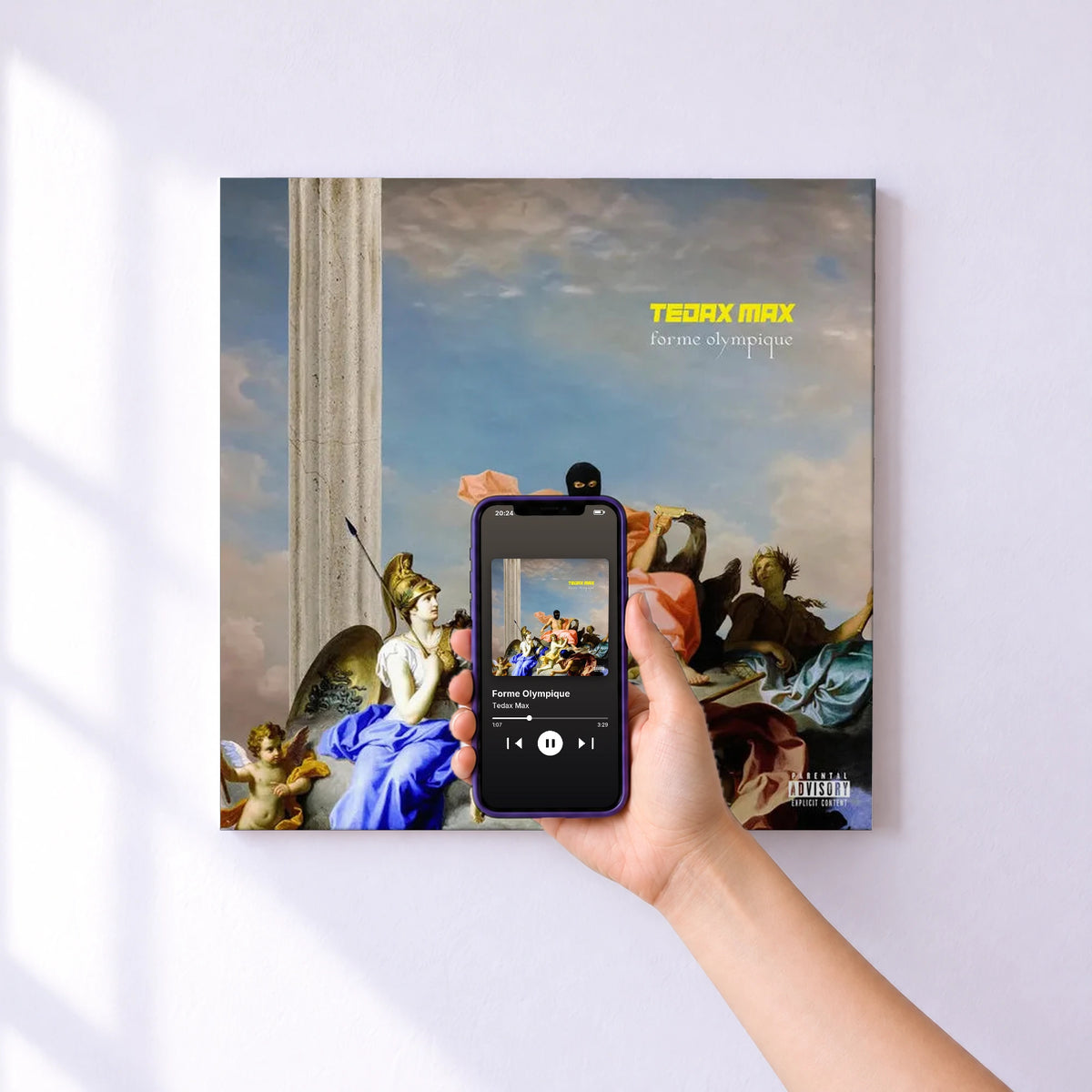 Affiche connectée Forme Olympique de Tedax Max au mur : l'album se lance en approchant le téléphone