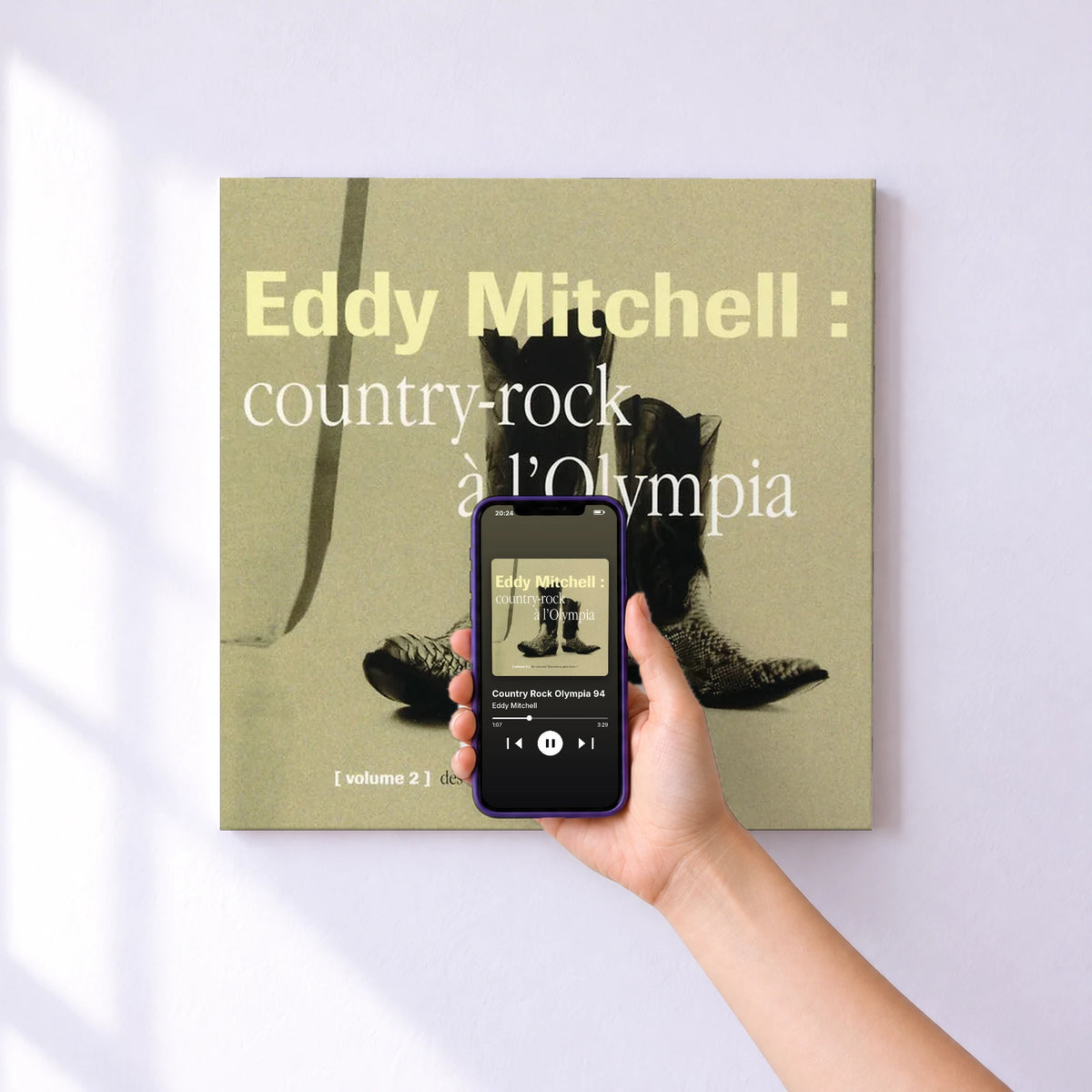 Affiche connectée Country Rock Olympia 94 de Eddy Mitchell au mur : l'album se lance en approchant le téléphone