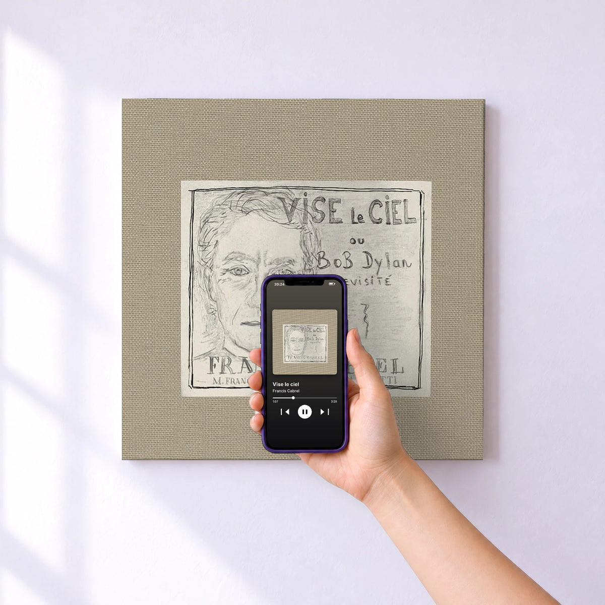 Affiche connectée Vise le ciel de Francis Cabrel au mur : l'album se lance en approchant le téléphone