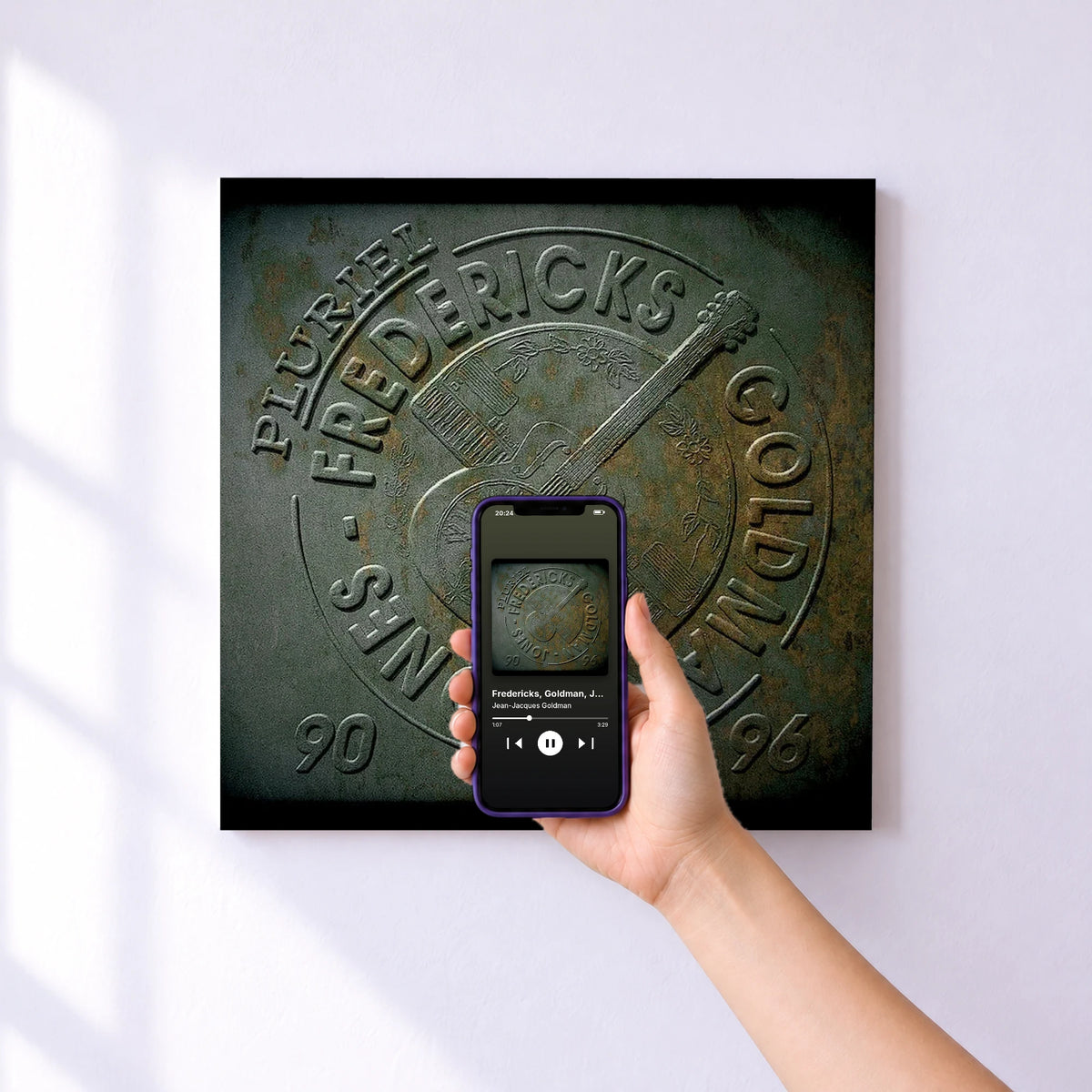 Affiche connectée Fredericks, Goldman, Jones : Pluriel de Jean-Jacques Goldman au mur : l'album se lance en approchant le téléphone