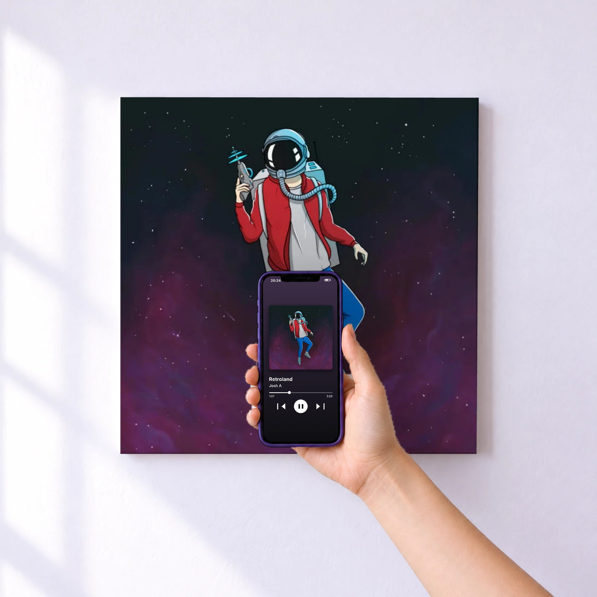 Affiche connectée Retroland de Josh A au mur : l'album se lance en approchant le téléphone