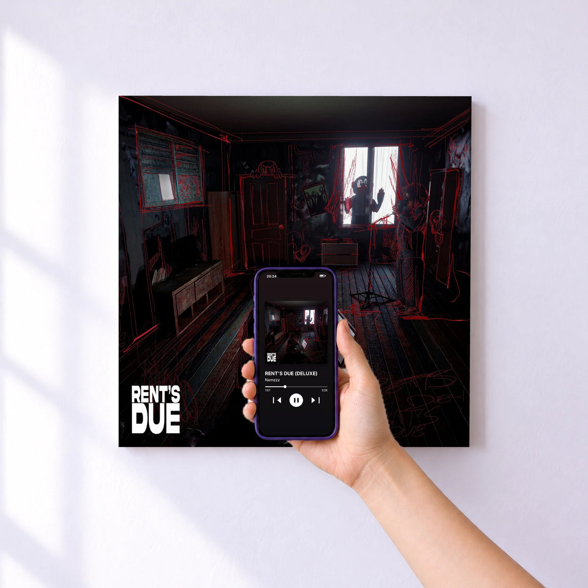 Affiche connectée RENT'S DUE (DELUXE) de Nemzzz au mur : l'album se lance en approchant le téléphone