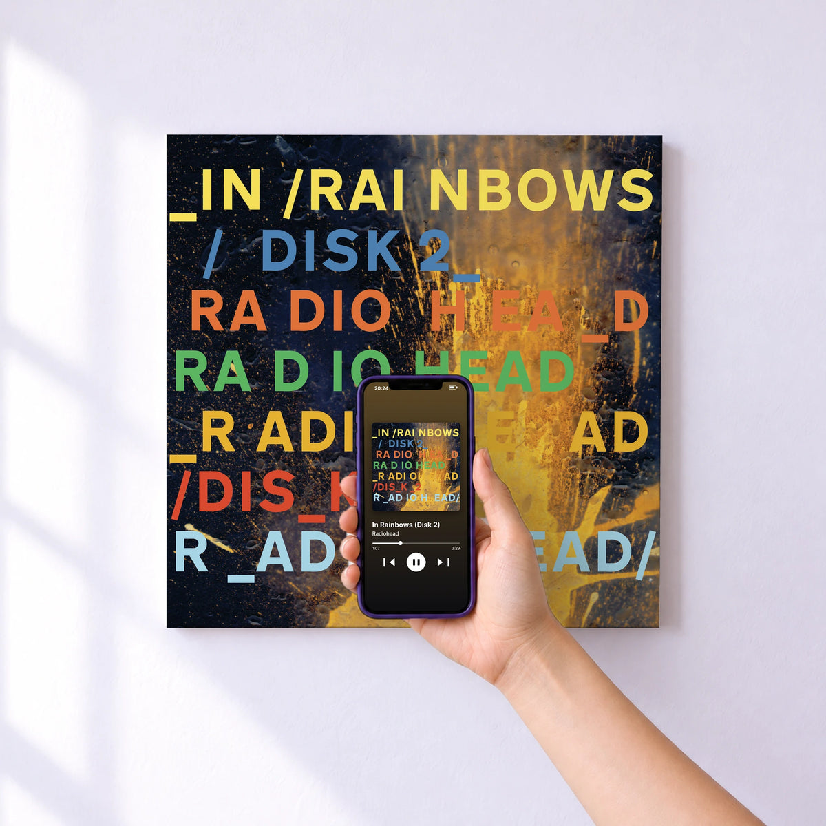 Affiche connectée In Rainbows (Disk 2) de Radiohead au mur : l'album se lance en approchant le téléphone